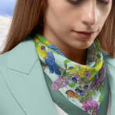 Woman wearing a floral and butterfly Dark Peak Floral Silk Scarf
